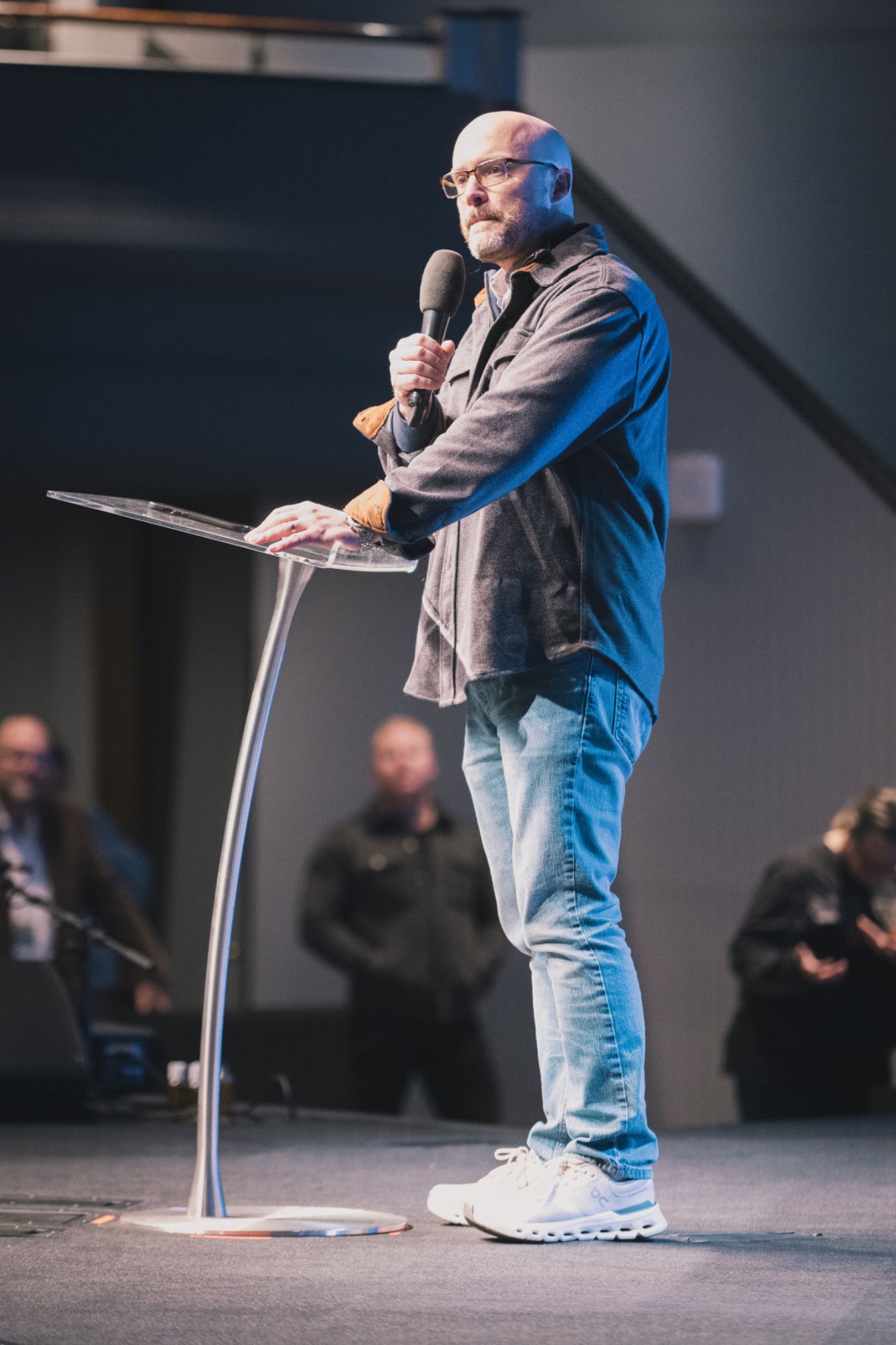 Zach de Vaux speaking at a church event